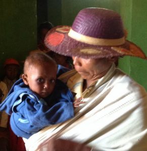 A recent family at our clinic.  The child, Rochelle, was two years old and weighted just 6 kg.  Please keep Rochelle, and his family, in your prayers.