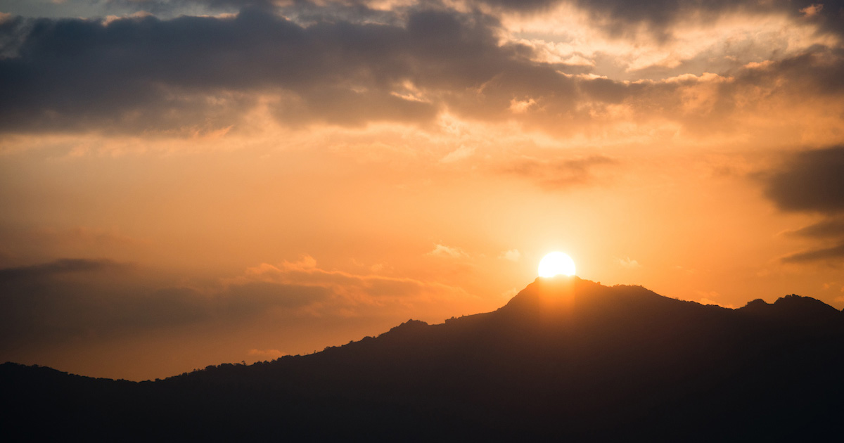 Orange sunrise over a mountaintop